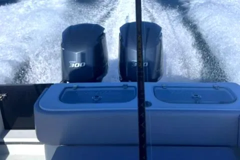 Slide: The Image of 2003 Contender 31 Open boat with twin 300 horsepower engines in action. - 12