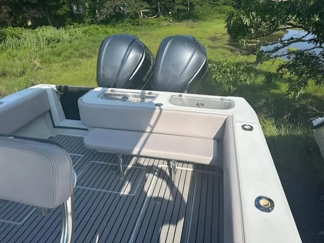 Slide: The Image of 2003 Contender 31 Open boat with twin outboard engines and spacious deck. - 13