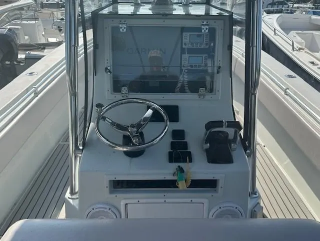 Slide: The Image of 2003 Contender 31 Open boat console with Garmin navigation system. - 4