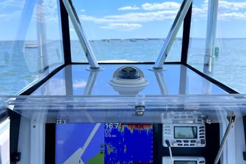 Slide: The Image of 2003 Contender 31 Open boat dashboard with navigation and communication equipment. - 5
