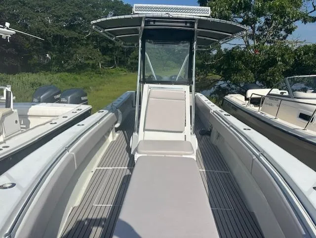 Slide: The Image of 2003 Contender 31 Open boat with center console and twin outboard engines. - 8