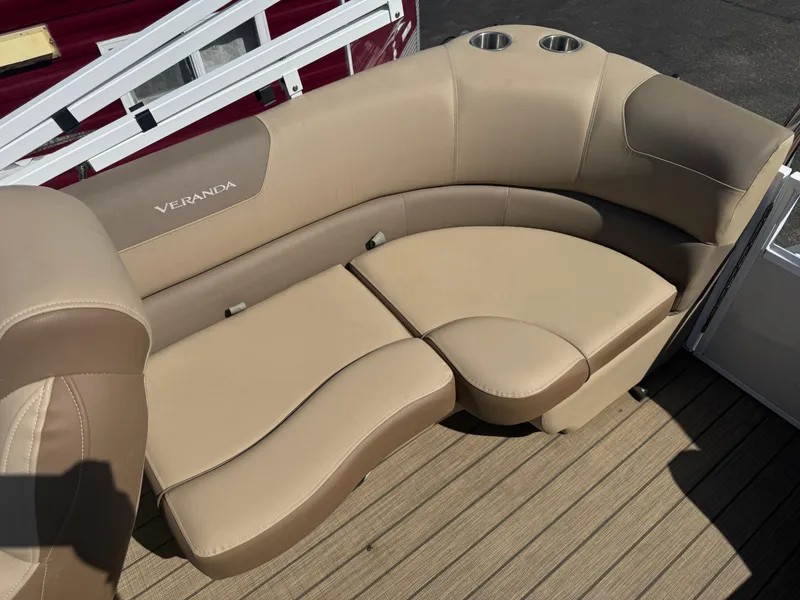 Slide: The Image of 2023 Veranda Relax VR20RC boat seating with beige upholstery and cup holders. - 12