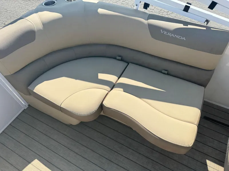Slide: The Image of Beige Veranda Relax VR20RC 2023 boat seating with cup holders on wooden deck. - 13