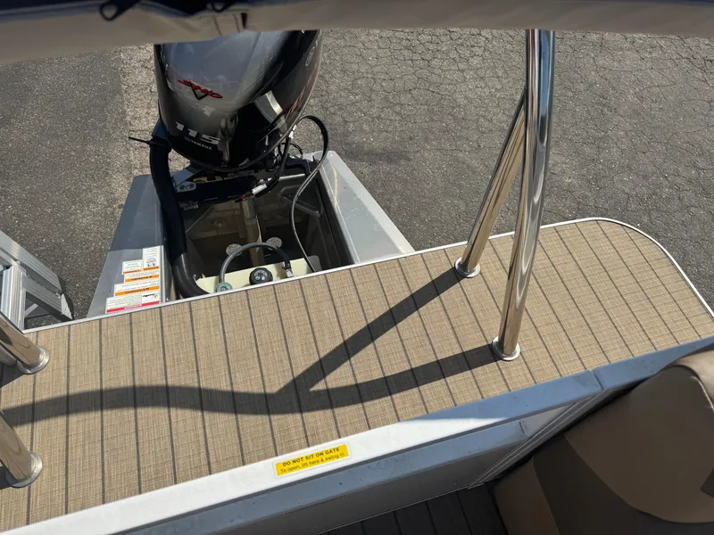Slide: The Image of Veranda Relax VR20RC 2023 boat deck with Yamaha outboard motor, featuring sleek metal railings. - 14