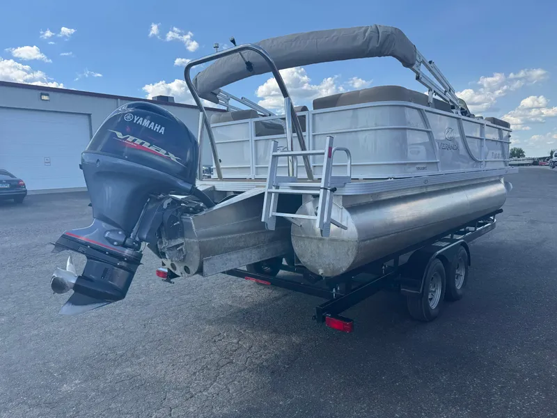Slide: The Image of 2023 Veranda Relax VR20RC pontoon boat with Yamaha outboard motor on trailer. - 3