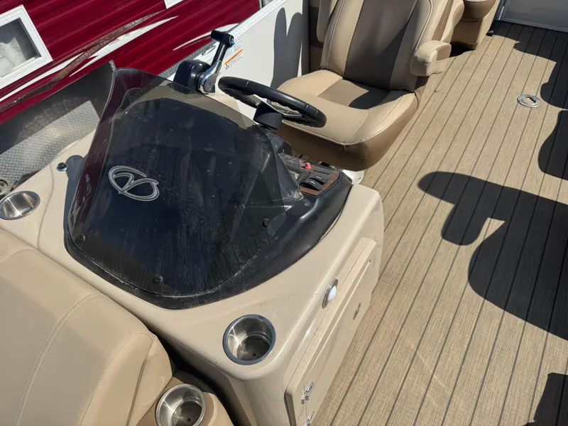 Slide: The Image of 2023 Veranda Relax VR20RC boat interior with steering console and seating. - 9