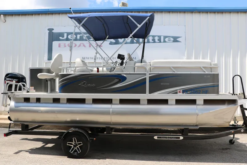 Slide: The Image of 2020 Qwest 818 EDGE pontoon boat with blue canopy on trailer. - 16