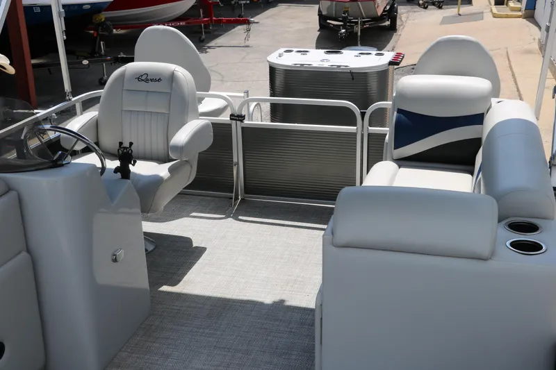 Slide: The Image of 2020 Qwest 818 EDGE boat interior with plush seating and steering console. - 20
