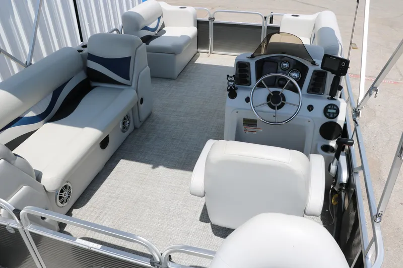 Slide: The Image of 2020 Qwest 818 EDGE pontoon boat interior with seating and steering console. - 23