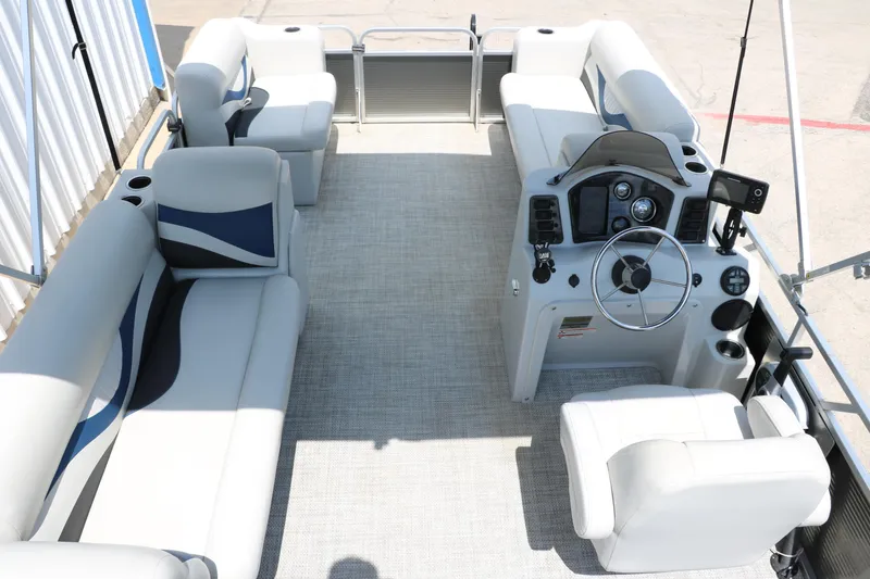 Slide: The Image of 2020 Qwest 818 EDGE pontoon boat interior with plush seating and modern helm. - 24