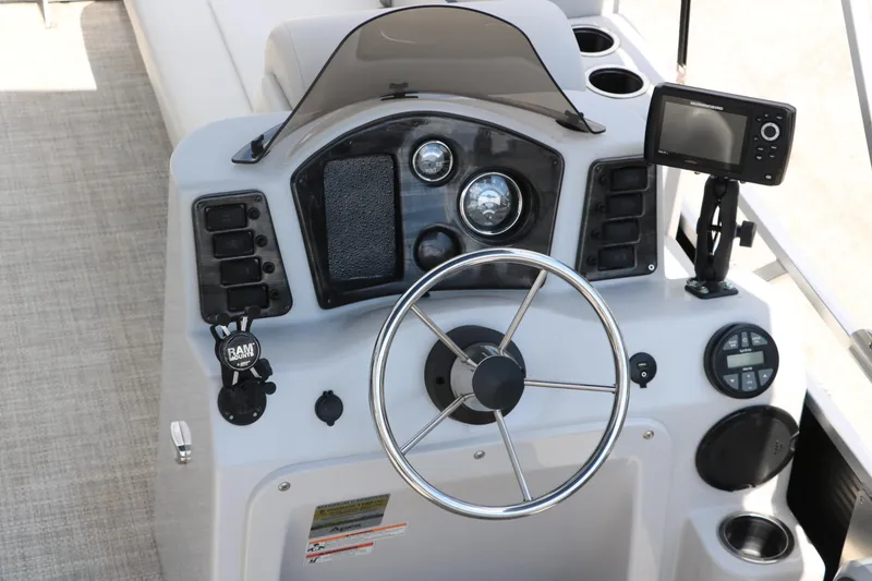 Slide: The Image of 2020 Qwest 818 EDGE boat dashboard with steering wheel and navigation equipment. - 25