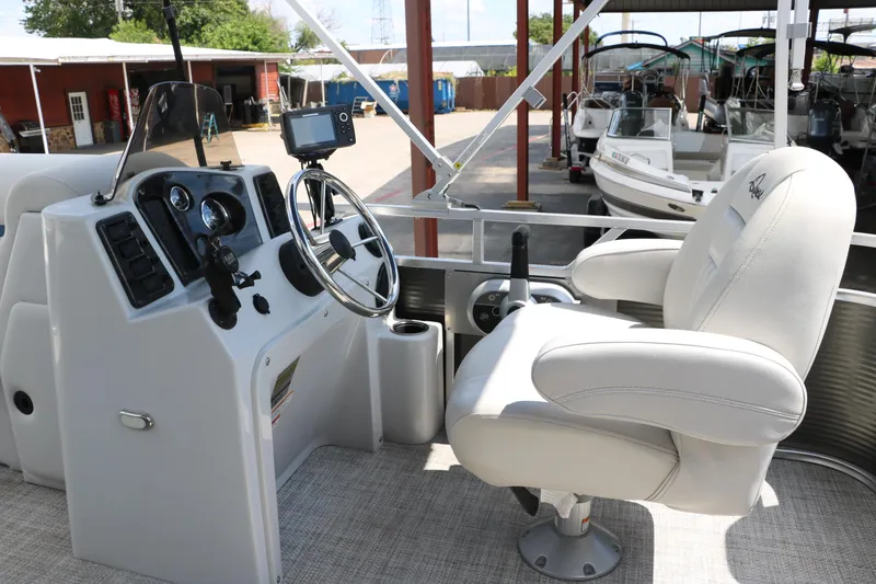 Slide: The Image of 2020 Qwest 818 EDGE boat cockpit with steering wheel and captain's chair. - 28
