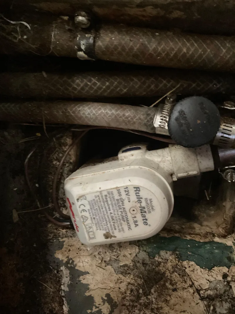 Slide: The Image of Bilge pump and hoses in 1983 Jeanneau Attalia sailboat. - 20