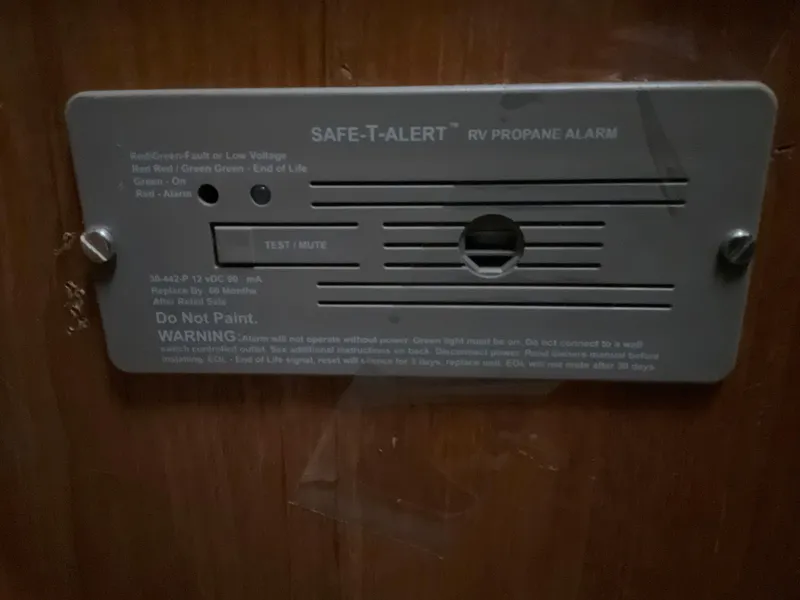 Slide: The Image of SAFE-T-ALERT RV propane alarm on 1983 Jeanneau Attalia boat interior. - 27