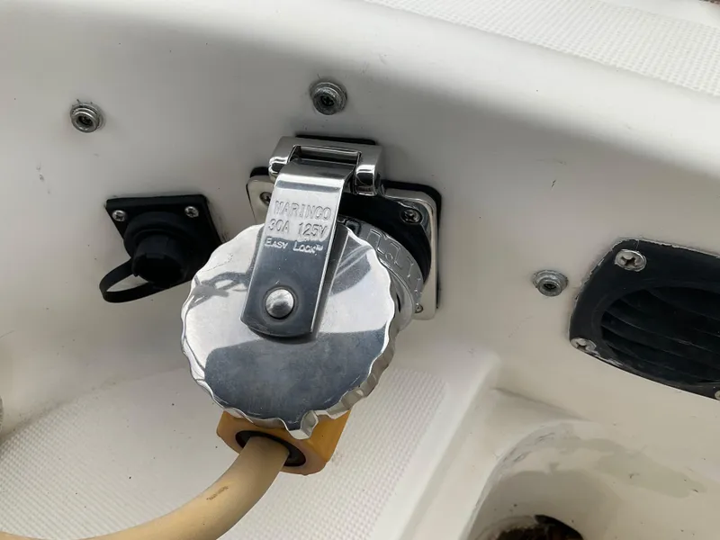 Slide: The Image of Power connection on 1983 Jeanneau Attalia boat, featuring Marinco 30A 125V Easy Lock system. - 34