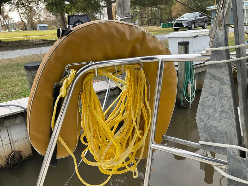Slide: The Image of Yellow rope and life ring on 1983 Jeanneau Attalia sailboat at dock. - 38