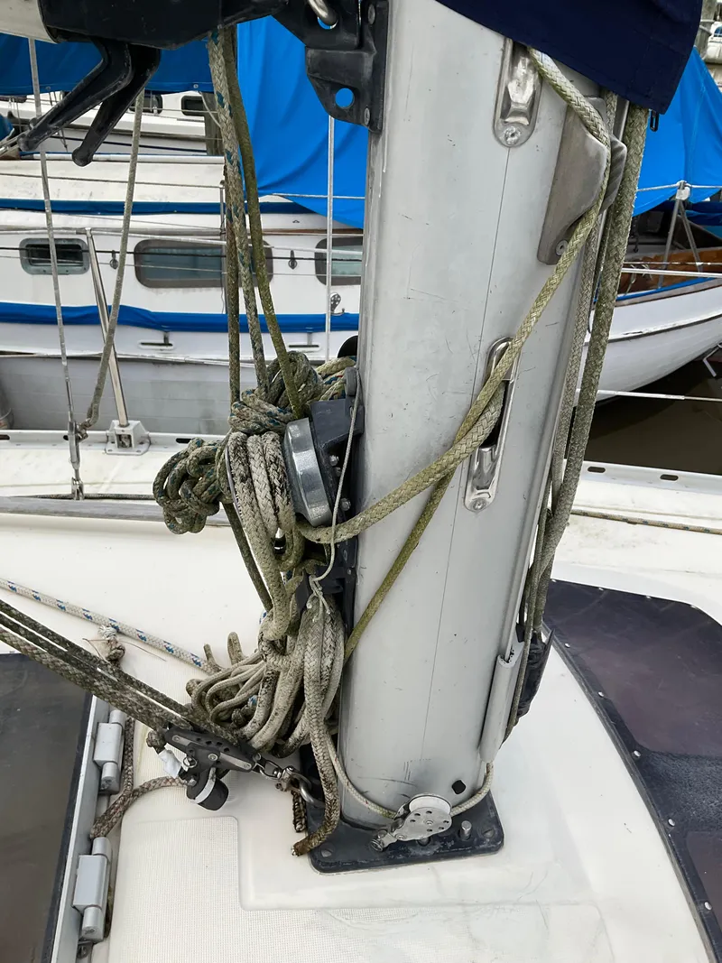 Slide: The Image of Close-up of 1983 Jeanneau Attalia sailboat mast with ropes and fittings. - 43