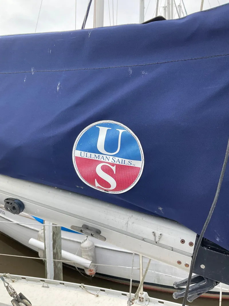 Slide: The Image of Jeanneau Attalia 1983 sailboat with Ullman Sails cover, docked at marina. - 44