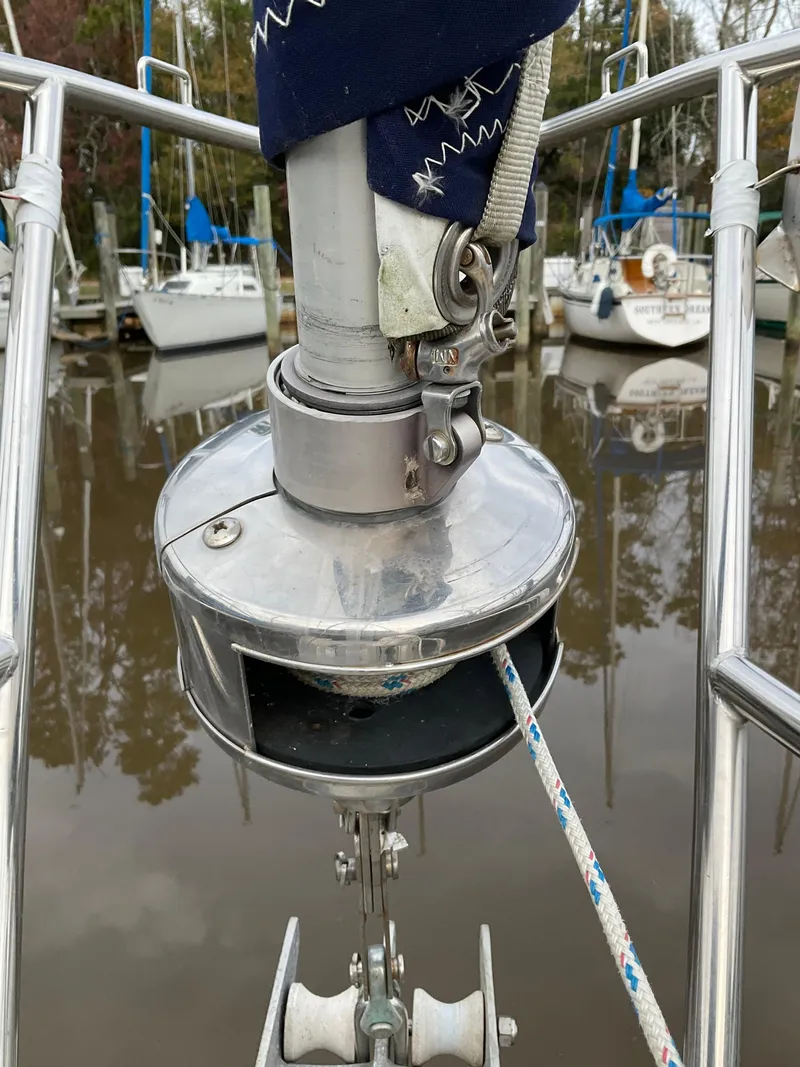 Slide: The Image of Close-up of Jeanneau Attalia 1983 sailboat's furling system at a marina. - 45