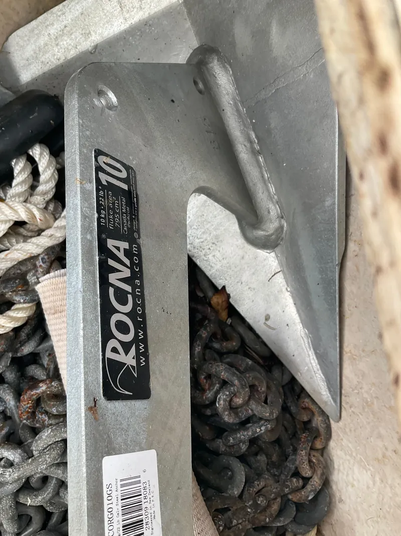 Slide: The Image of Rocna anchor with chain and rope on a 1983 Jeanneau Attalia sailboat. - 48