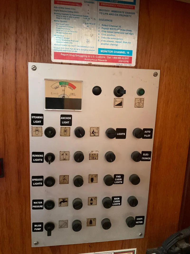 Slide: The Image of Control panel of a 1983 Jeanneau Attalia sailboat with various switches and indicators. - 6