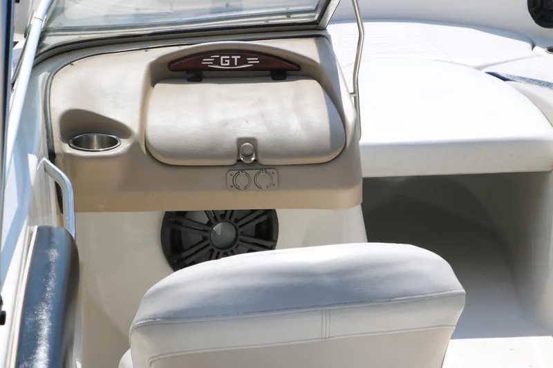 Slide: The Image of 2008 Glastron GT225 boat interior with seating and dashboard. - 23