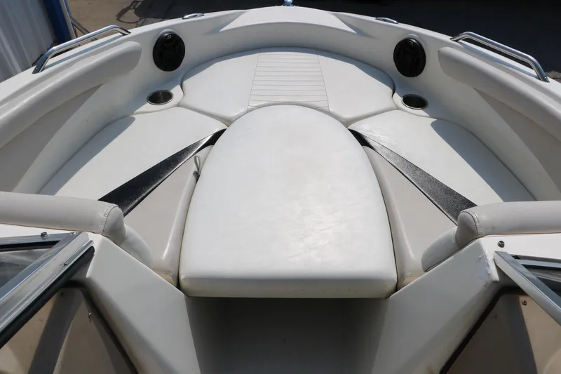 Slide: The Image of 2008 Glastron GT225 boat bow seating area with white upholstery. - 24