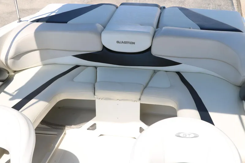 Slide: The Image of 2008 Glastron GT225 boat interior with cushioned seating. - 25