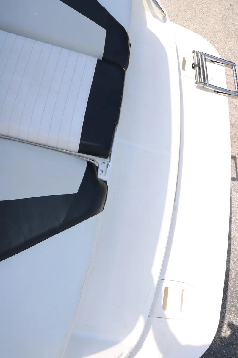 Slide: The Image of 2008 Glastron GT225 boat with white and black seating. - 34
