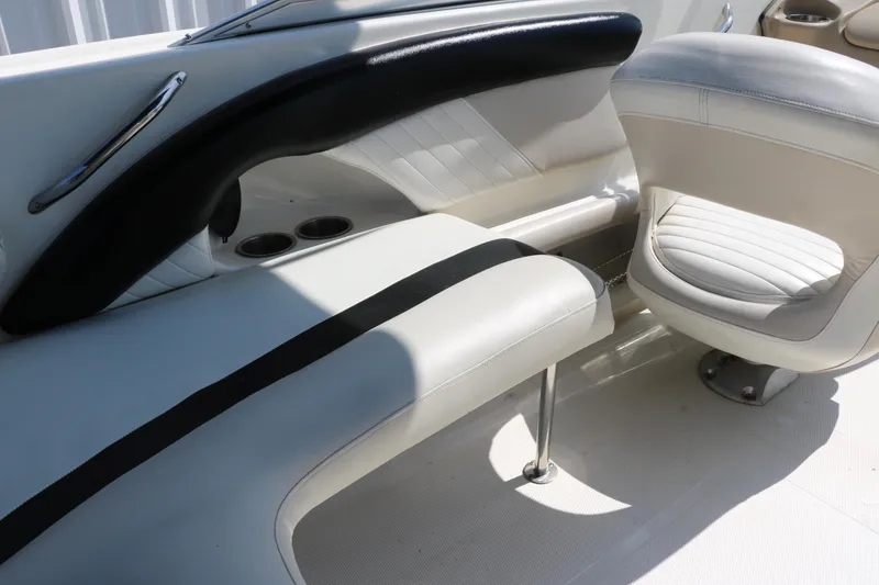Slide: The Image of Interior seating of a 2008 Glastron GT225 boat with white and black upholstery. - 39