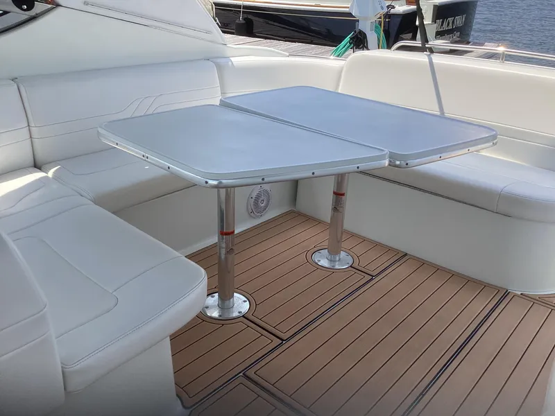 Slide: The Image of 2007 Formula 400 Super Sport boat interior with white seating and wooden deck. - 10