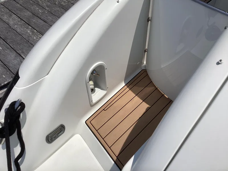 Slide: The Image of 2007 Formula 400 Super Sport boat deck with wood flooring. - 12