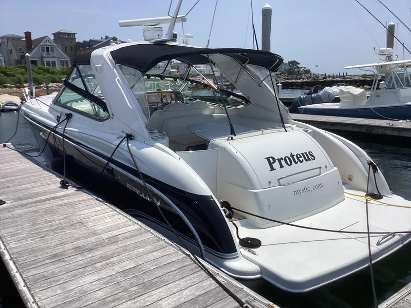 Slide: The Image of 2007 Formula 400 Super Sport yacht docked at marina. - 2