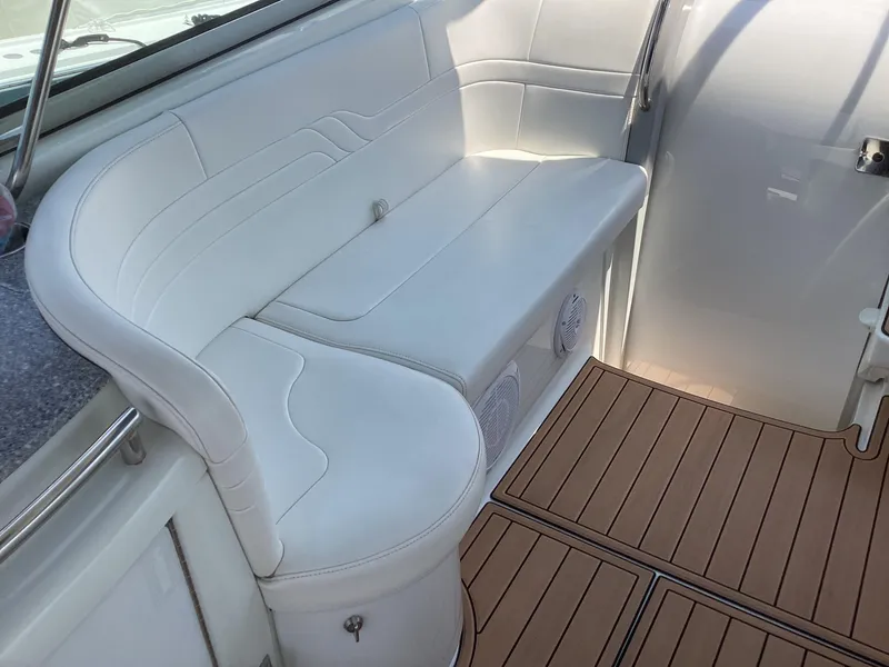 Slide: The Image of 2007 Formula 400 Super Sport boat interior with white leather seating and teak flooring. - 8