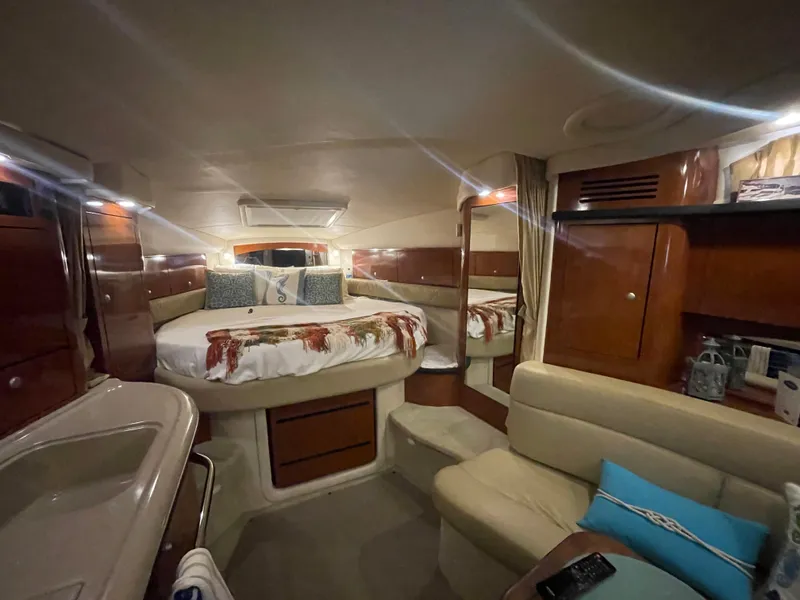 Slide: The Image of Luxurious interior of 2007 Sea Ray 340 Sundancer yacht with cozy bed and seating area. - 10