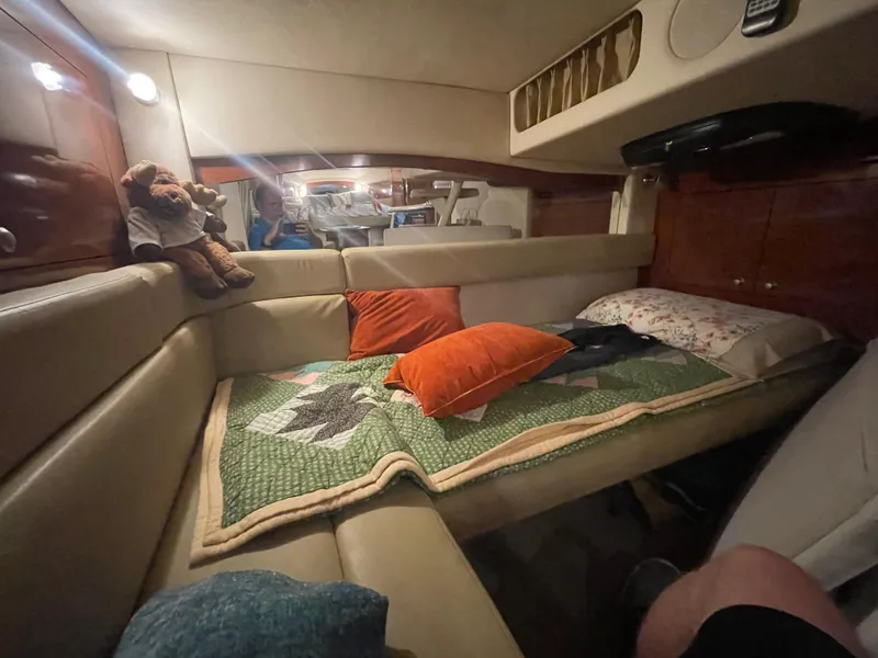 Slide: The Image of Interior cabin of 2007 Sea Ray 340 Sundancer with cozy seating and decorative pillows. - 14