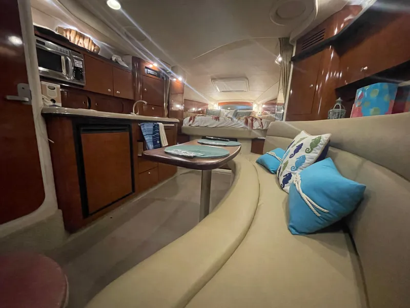 Slide: The Image of Interior of 2007 Sea Ray 340 Sundancer yacht with cozy seating and modern amenities. - 15