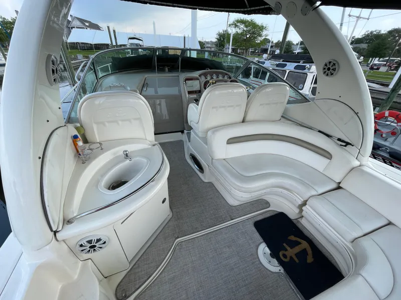 Slide: The Image of 2007 Sea Ray 340 Sundancer boat interior with white seating and helm. - 17