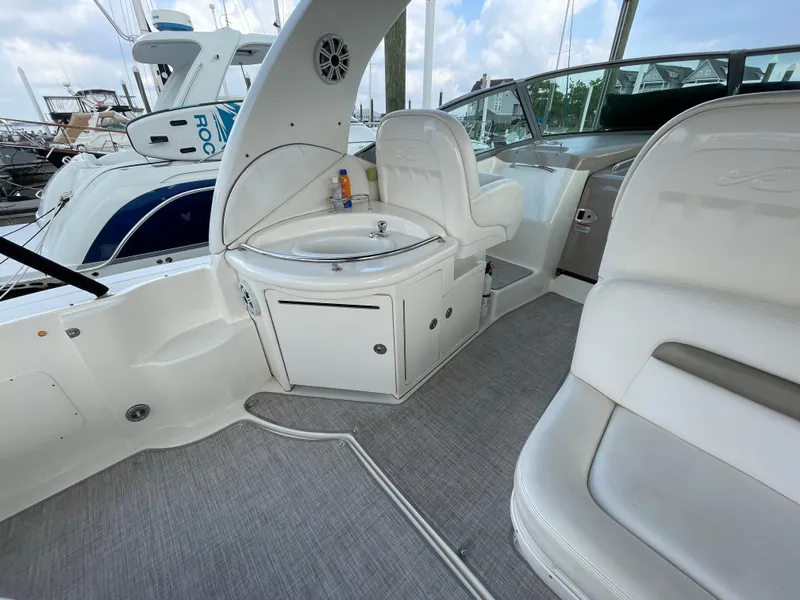 Slide: The Image of 2007 Sea Ray 340 Sundancer boat interior with seating and sink area. - 19
