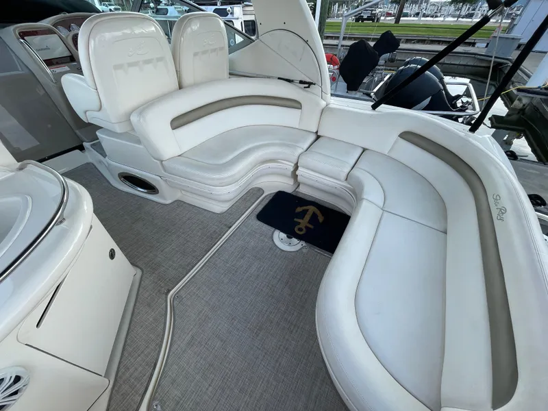 Slide: The Image of 2007 Sea Ray 340 Sundancer interior with white leather seating and elegant design. - 26