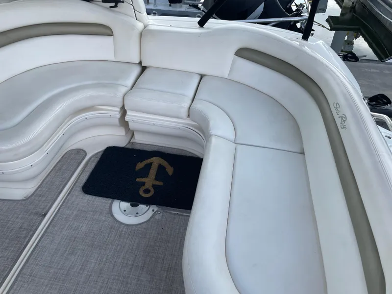 Slide: The Image of 2007 Sea Ray 340 Sundancer boat interior with white seating and anchor-themed mat. - 27