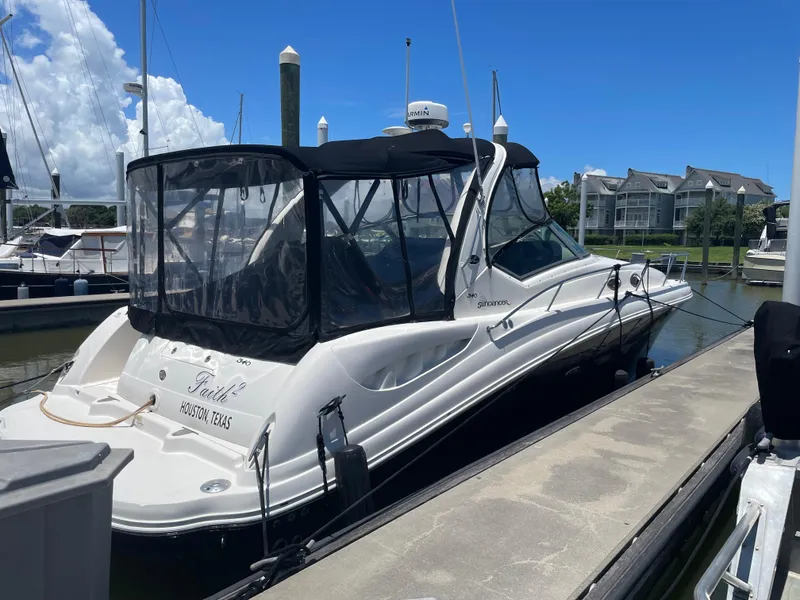 Slide: The Image of 2007 Sea Ray 340 Sundancer docked at marina under clear blue sky. - 3