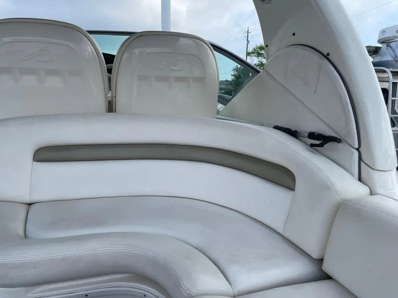 Slide: The Image of 2007 Sea Ray 340 Sundancer interior seating with white and beige upholstery. - 31