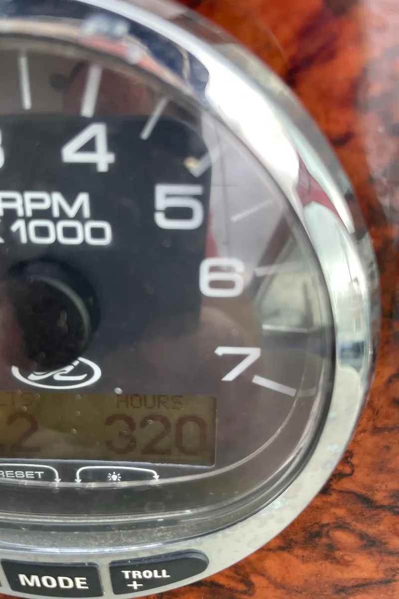 Slide: The Image of Close-up of a 2007 Sea Ray 340 Sundancer tachometer displaying RPM and engine hours. - 39