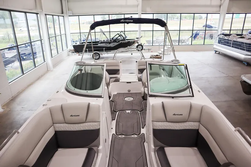 Slide: The Image of 2024 Hurricane SunDeck 2486 OB boat interior in showroom. - 14
