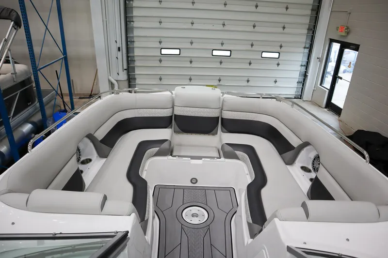 Slide: The Image of 2024 Hurricane SunDeck 2486 OB boat interior with spacious seating. - 16