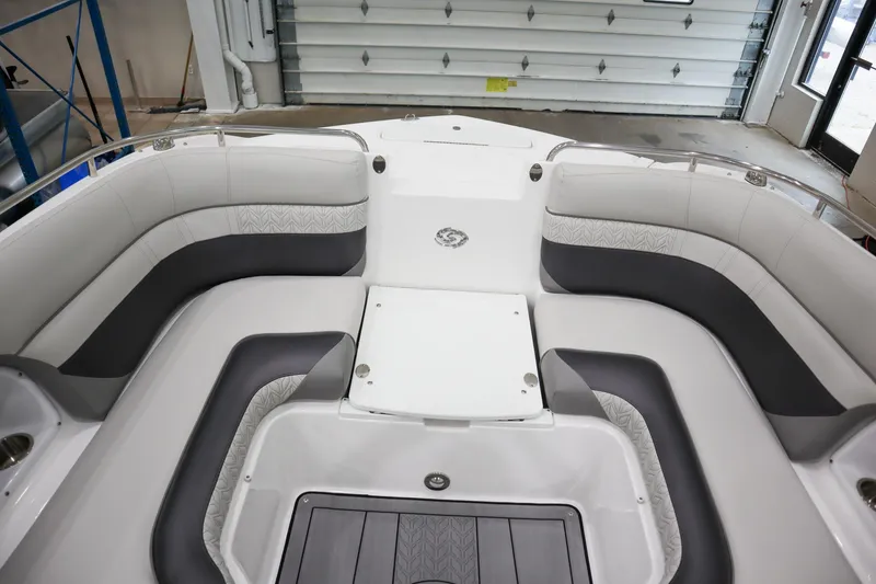 Slide: The Image of 2024 Hurricane SunDeck 2486 OB interior seating area in a showroom. - 17