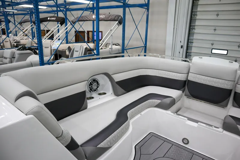 Slide: The Image of 2024 Hurricane SunDeck 2486 OB interior seating area in showroom. - 19