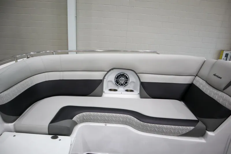 Slide: The Image of 2024 Hurricane SunDeck 2486 OB boat interior seating with modern design and built-in speaker. - 21