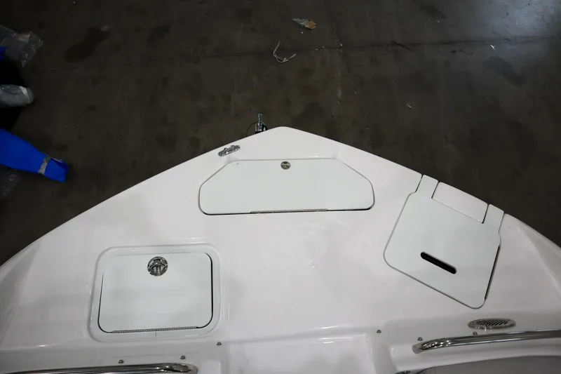 Slide: The Image of 2024 Hurricane SunDeck 2486 OB boat deck with storage compartments. - 22